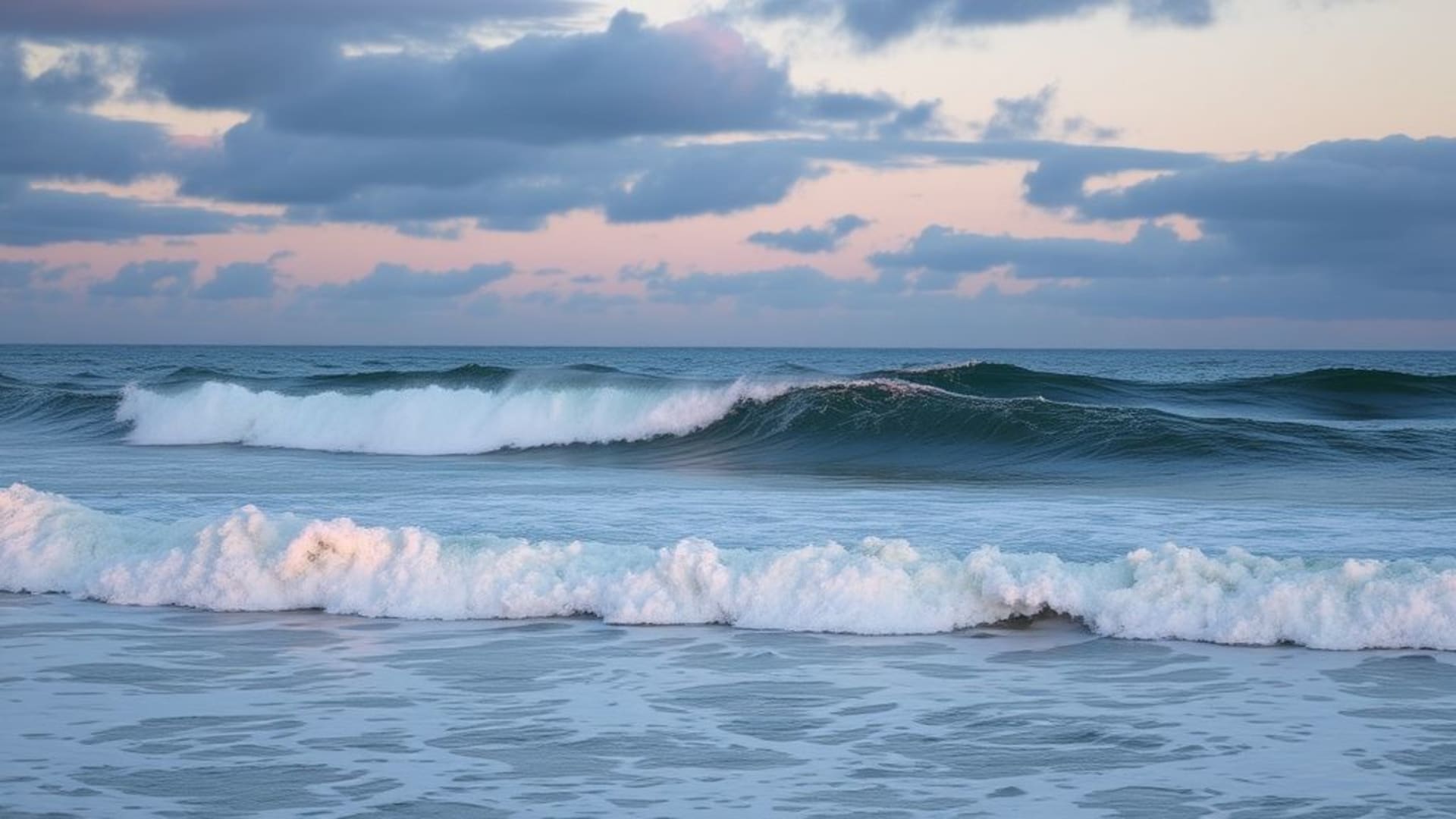 vagues apaisantes de l'océan sous un coucher de soleil pastel
